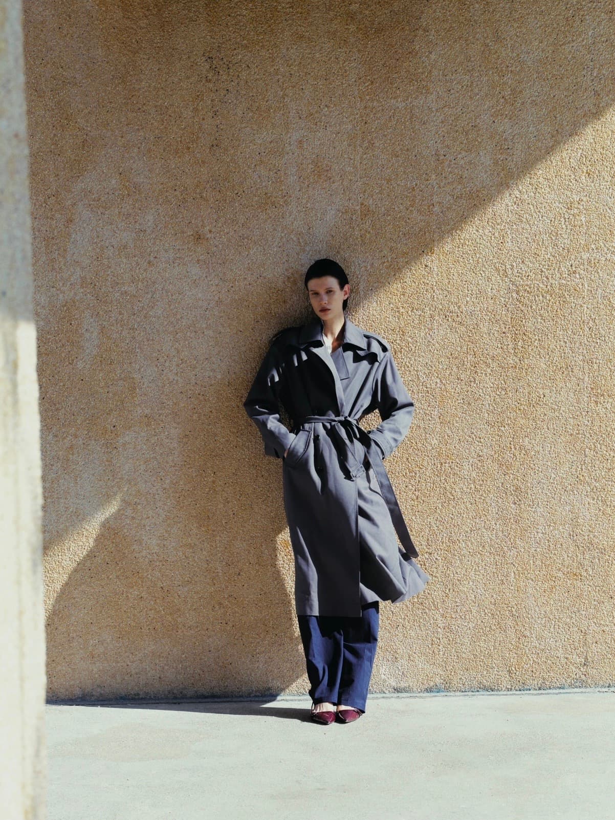 Gentle Authority model wearing a grey trench coat