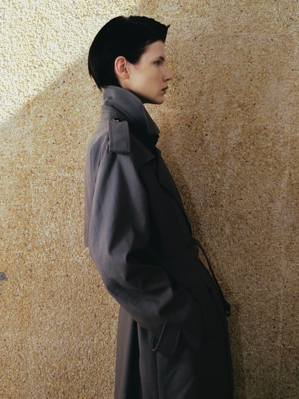 Gentle Authority side profile in a structured coat