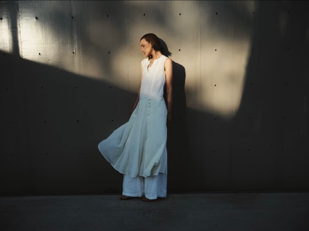 Gentle Authority white dress in shadowed natural light