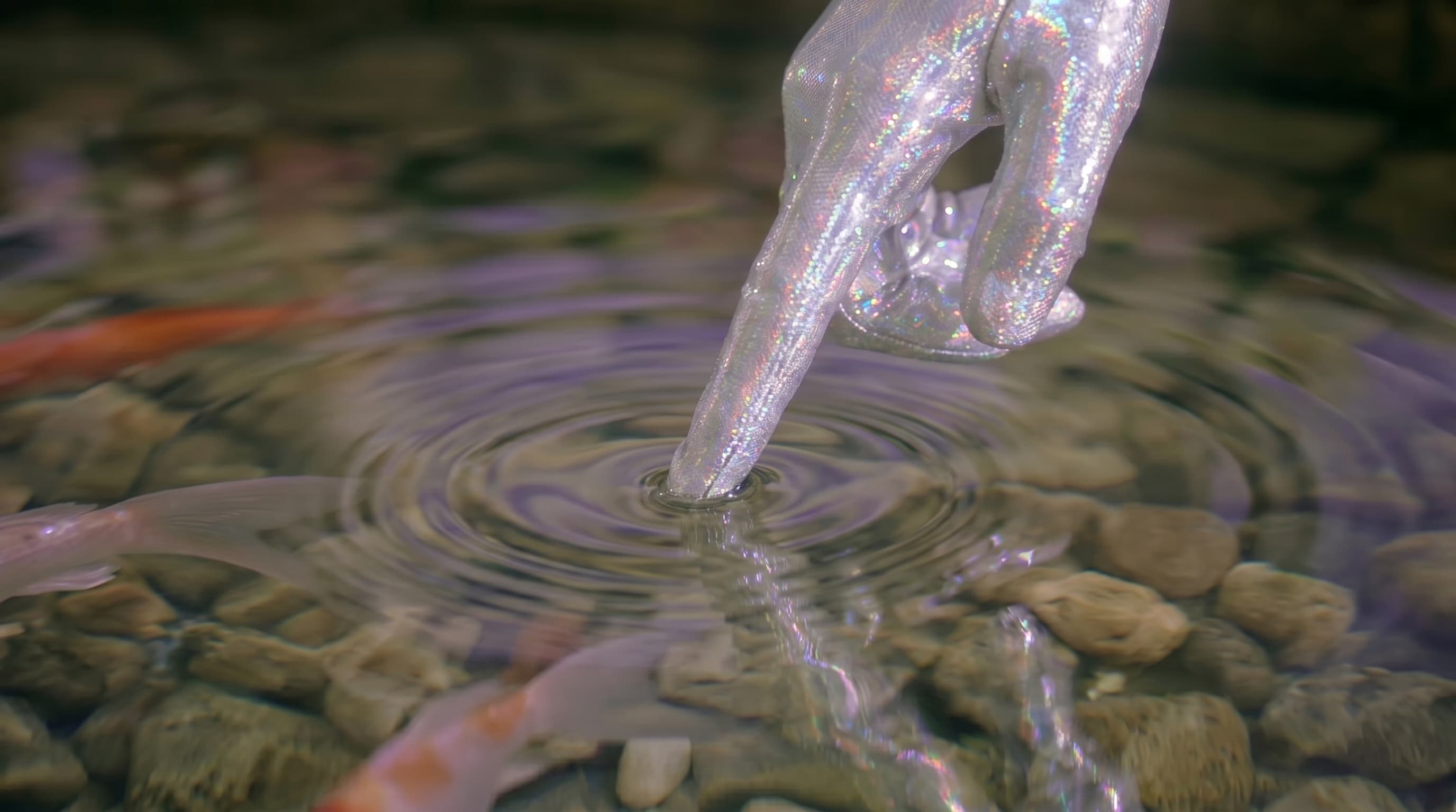 Pink-clad figures walking through a soft mirrored landscape