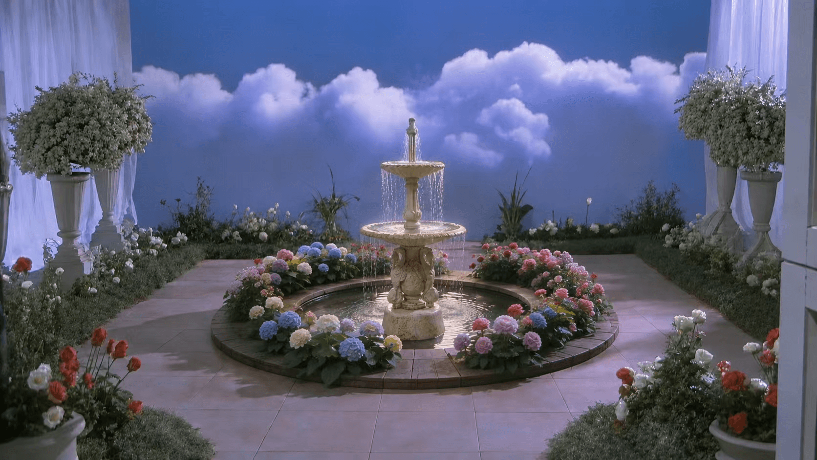 Dreamlike garden set with a fountain, flowers, and a cloud backdrop